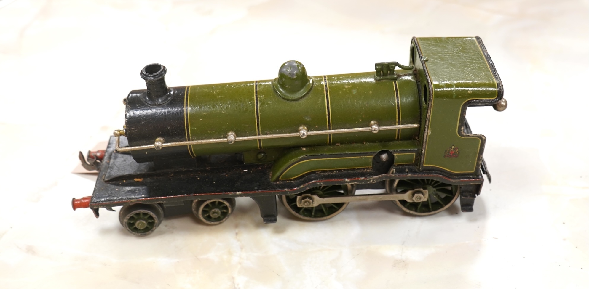 A Bing for Bassett Lowke 0 gauge tinplate clockwork LNER Ivatt 4-4-0 tender locomotive, 4390, together with an early Hornby clockwork 0-4-0, 2710, in GNR green livery with Meccano Ltd roundels to locomotive splasher and